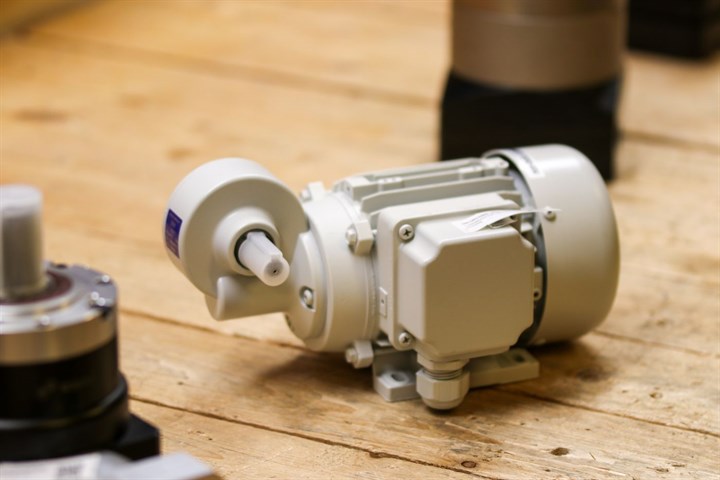 An industrial gearmotor on a workbench